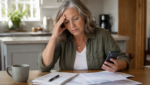 A Florida disability applicant reviewing Social Security paperwork at home.